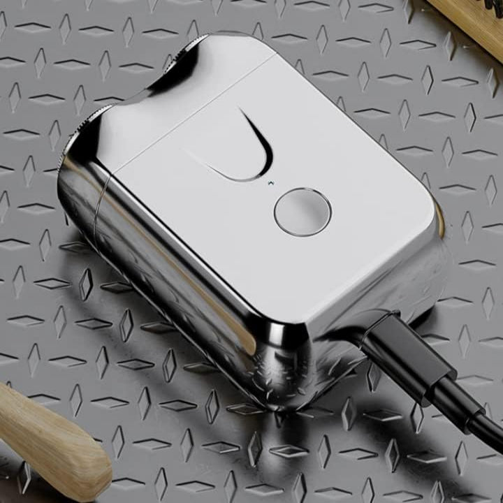 Dual Rotary Head Shaver with Wet and Dry Operation and Floating Blade System