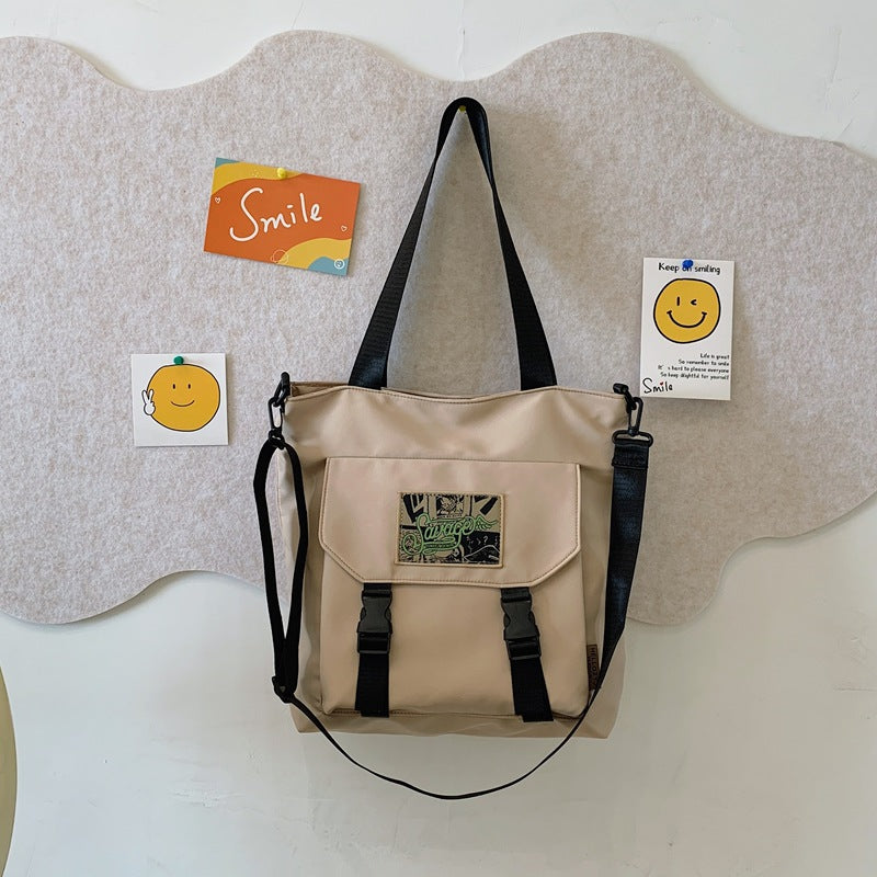 Convertible Shoulder Bag with Adjustable Strap and Multiple Interior Compartments