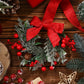 Artificial Christmas Wreath with Red Bows and Pinecone Accents