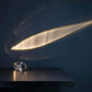 Crystal Atmosphere Lamp Elegant Ambient Lighting on a dark surface with a light beam effect