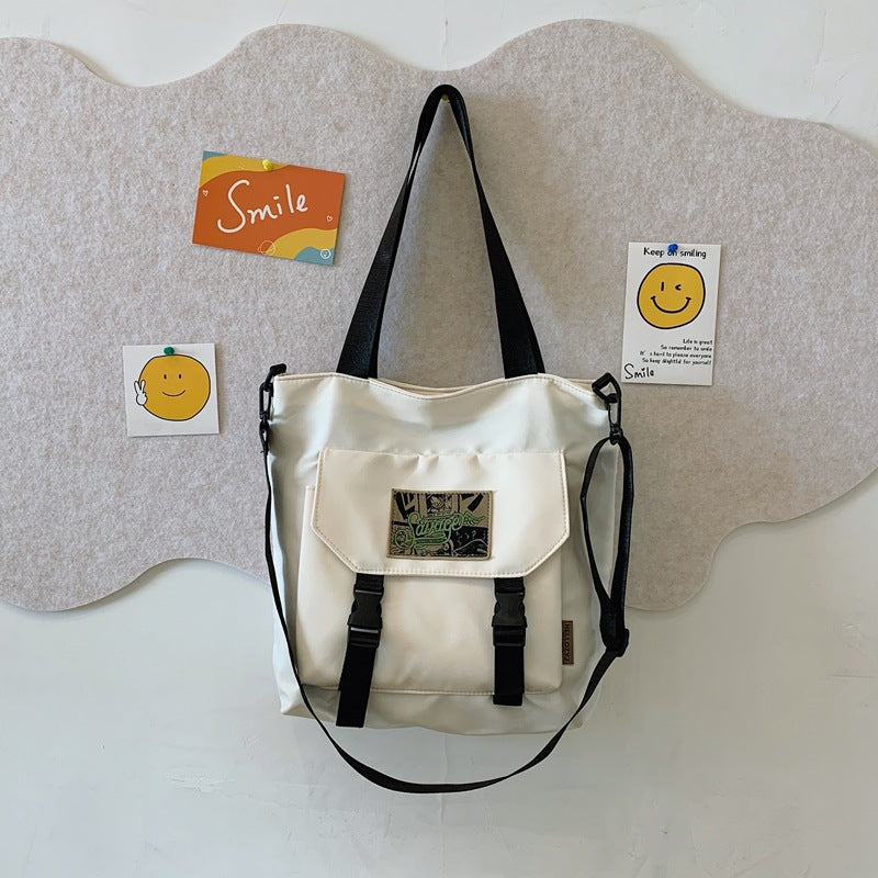 Convertible Shoulder Bag with Adjustable Strap and Multiple Interior Compartments