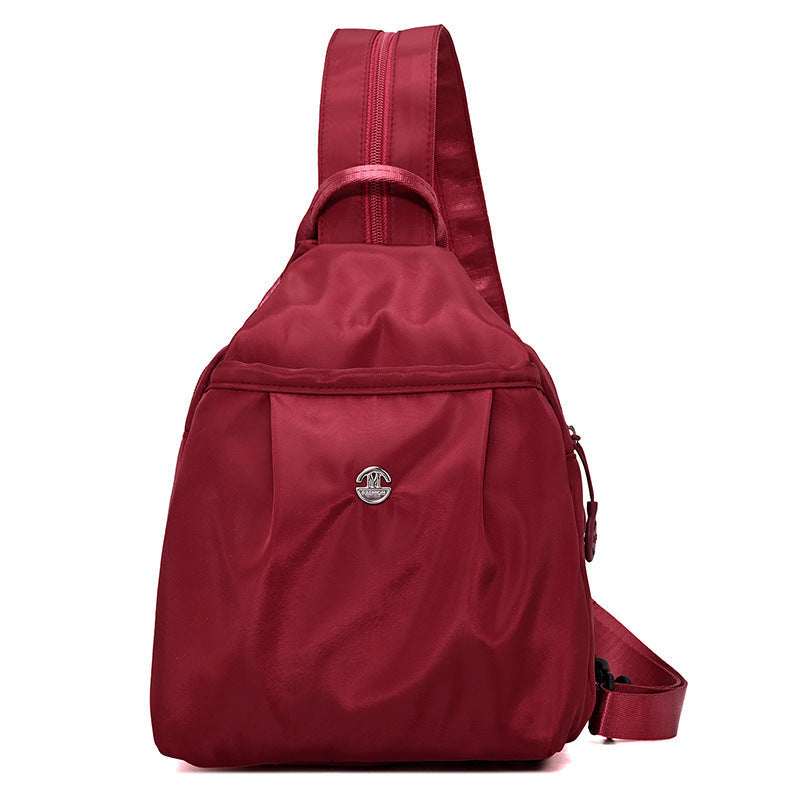 Sling Backpack with Adjustable Strap and Multiple Zippered Compartments