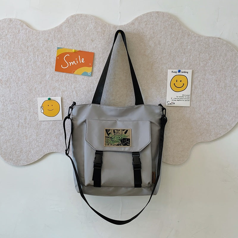 Convertible Shoulder Bag with Adjustable Strap and Multiple Interior Compartments