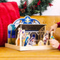 A kid playing with the Melissa & Doug Classic Wooden Christmas Nativity Set With 4-Piece Stable and 11 Wooden Figures