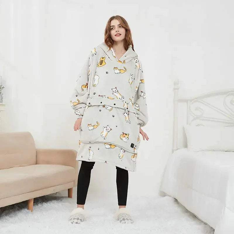Woman wearing a light gray cat Oversized Heatable Hoodie in a minimalistic room.