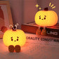 Cute Pumpkin Night Light on a surface with a blurred background