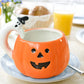 Ceramic Pumpkin Mug with Ghost Handle and Halloween Theme Design