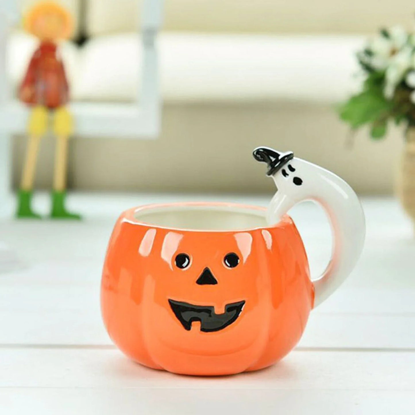 Ceramic Pumpkin Mug with Ghost Handle and Halloween Theme Design
