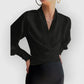 Flowy women's wrap blouse with long sleeves, offering a comfortable yet elegant style for work and daily wear.