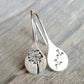 Elegant women's sterling silver dandelion teardrop dangle earrings. Unique handcrafted floral jewelry, perfect gift for her.