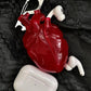 Protective Wireless Earphone Case with Anatomical Heart and Headphones Graphic Print