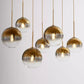 Modern Globe Pendant Light in Brushed Brass