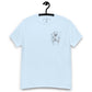 Light blue unisex T-shirt – abstract black line art  dog, front view on hanger.