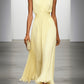 Elegant women's pleated maxi dress with a flattering ruched waist, suitable for wedding guest attire.