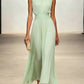 Formal occasion dress: sleeveless pleated maxi with a sophisticated ruched waist, perfect for parties.