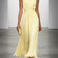 Sleek sleeveless long dress, pleated design, with a chic ruched waist for elegant wedding guest fashion.