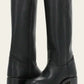 Fashionable women's mid-calf boots, featuring a sturdy block heel for comfort & style.
